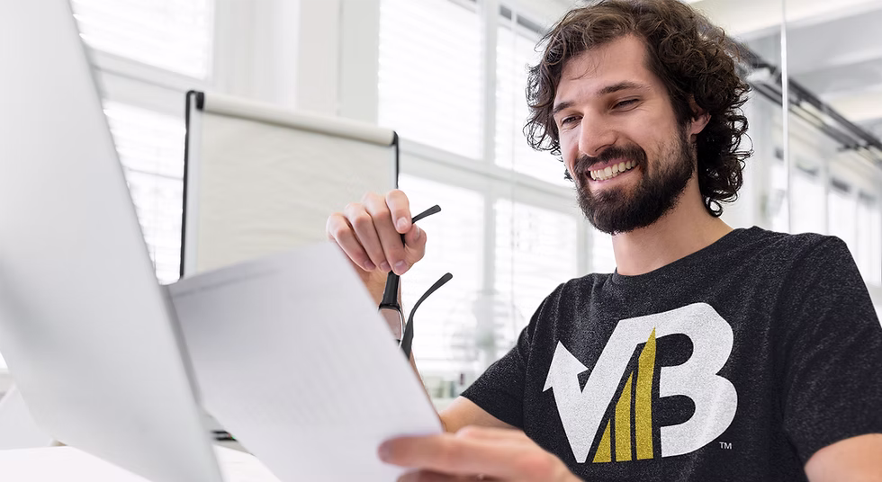 t-shirt-mockup-of-a-happy-man-reviewing-some-papers-40702-r-el2 (1)_edited.png